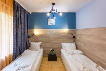 Фото номера Двухместный номер с 2 отдельными кроватями Отель Family Hotel Jemelly г. Обзор 3